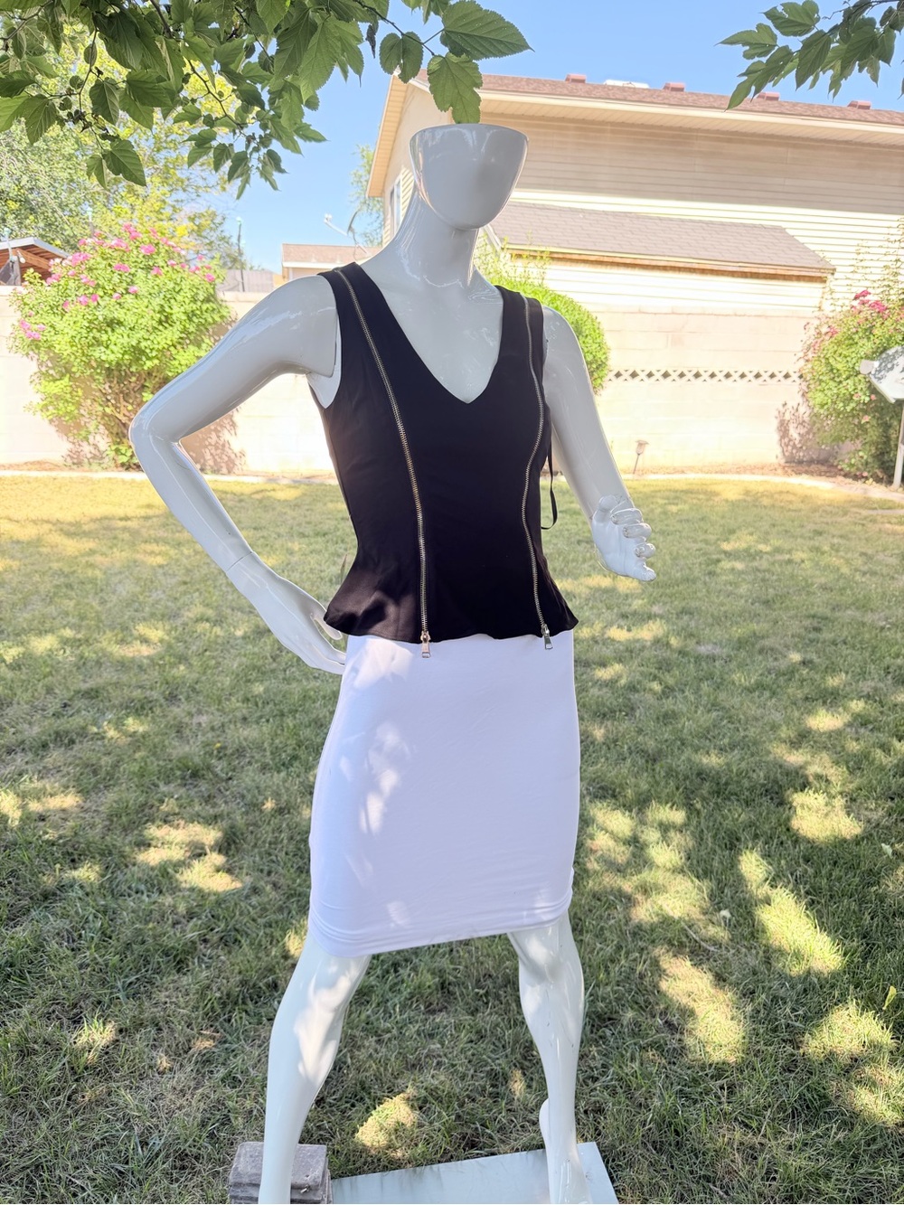 bebe Black Peplum V-Neck Top with Gold Zipper Accents
